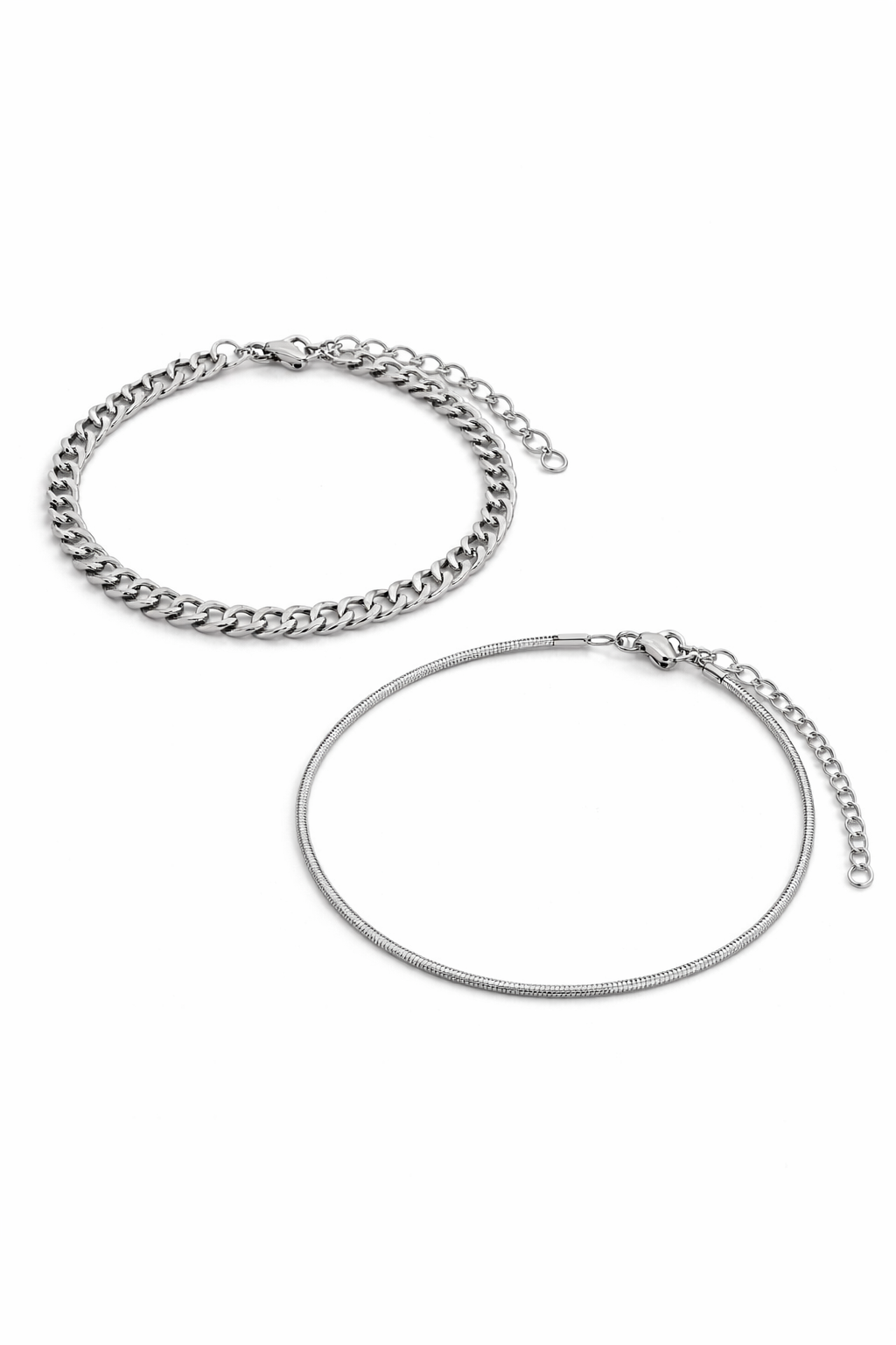 Two silver bracelets on a white background