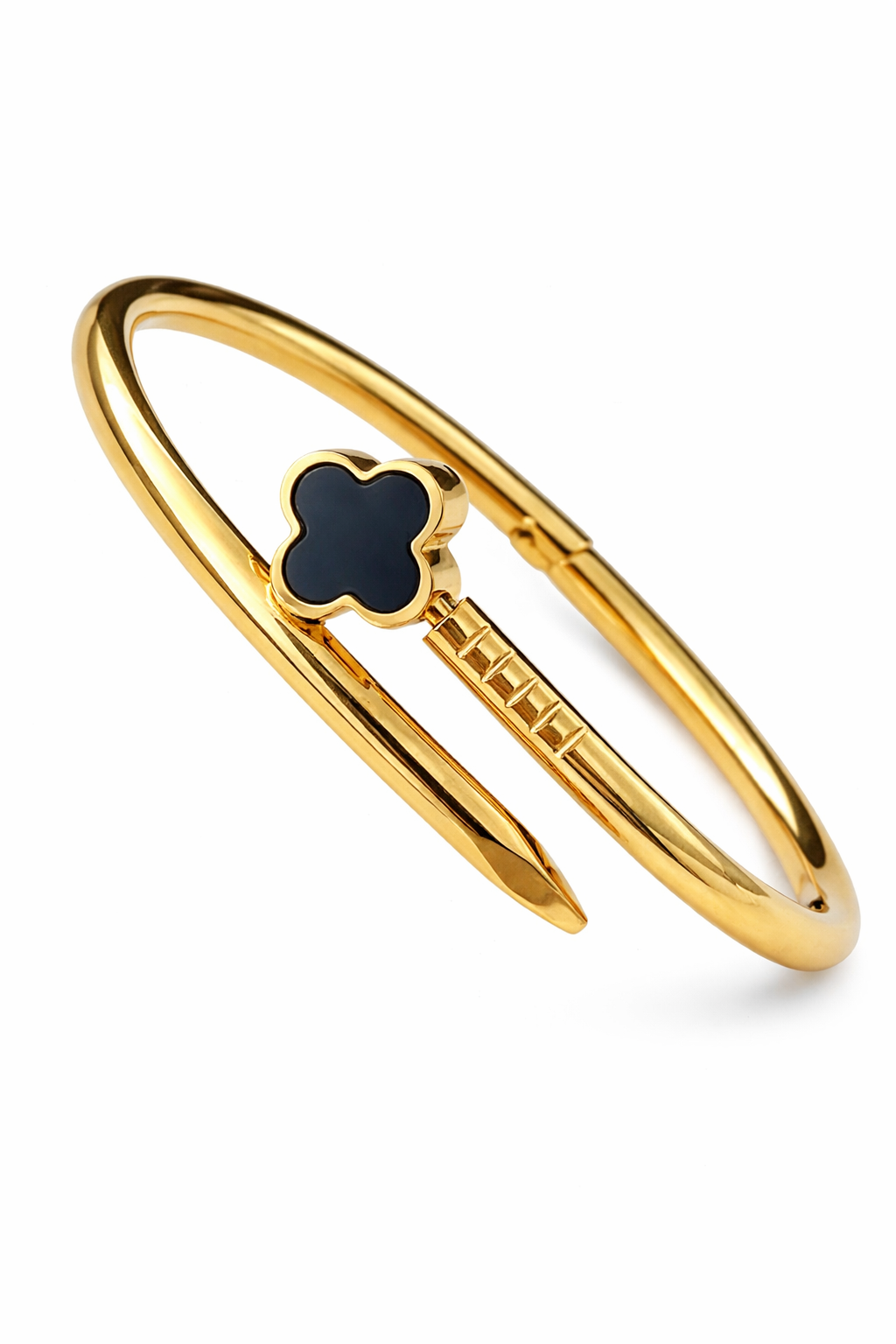 Gold bangle with a black clover-shaped charm on a white background