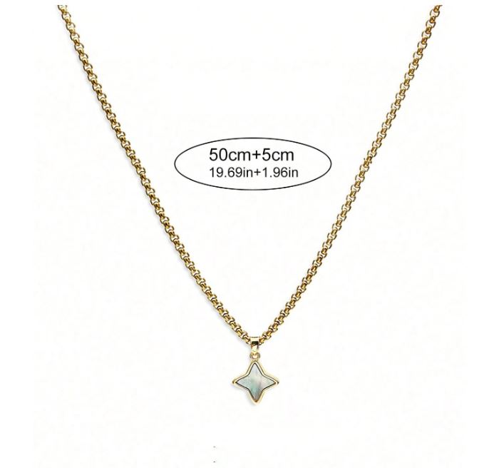 Gold necklace with a star-shaped pendant on a white background