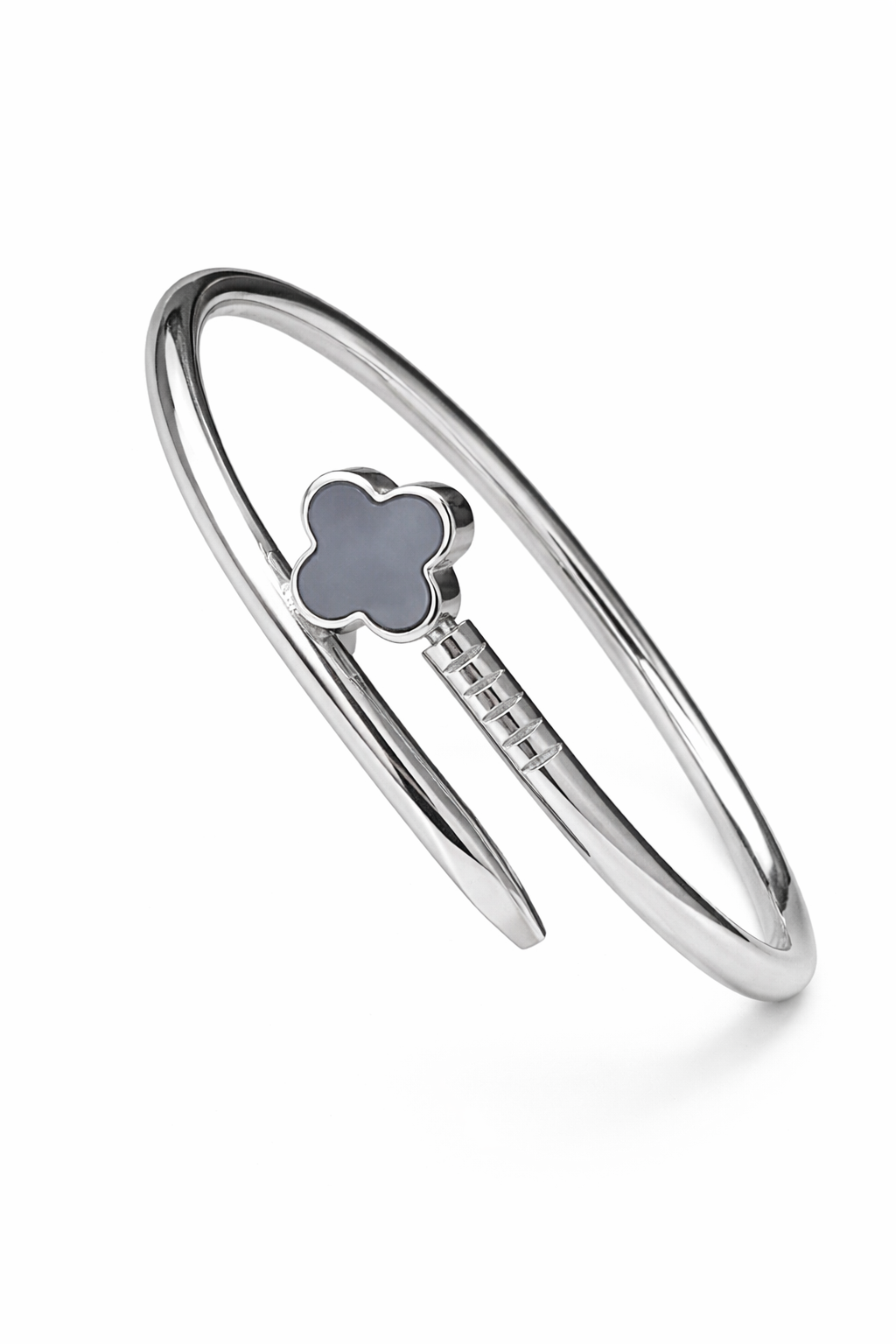 Silver bracelet with a clover-shaped charm on a white background