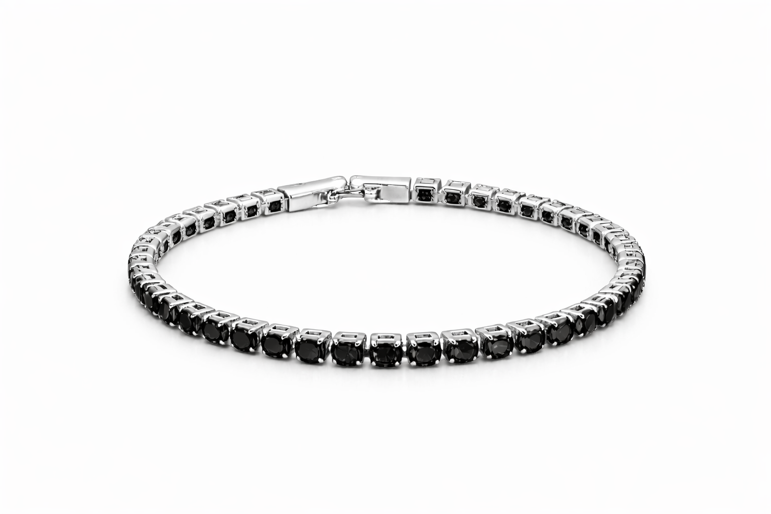 Silver bracelet with black gemstones on a white background