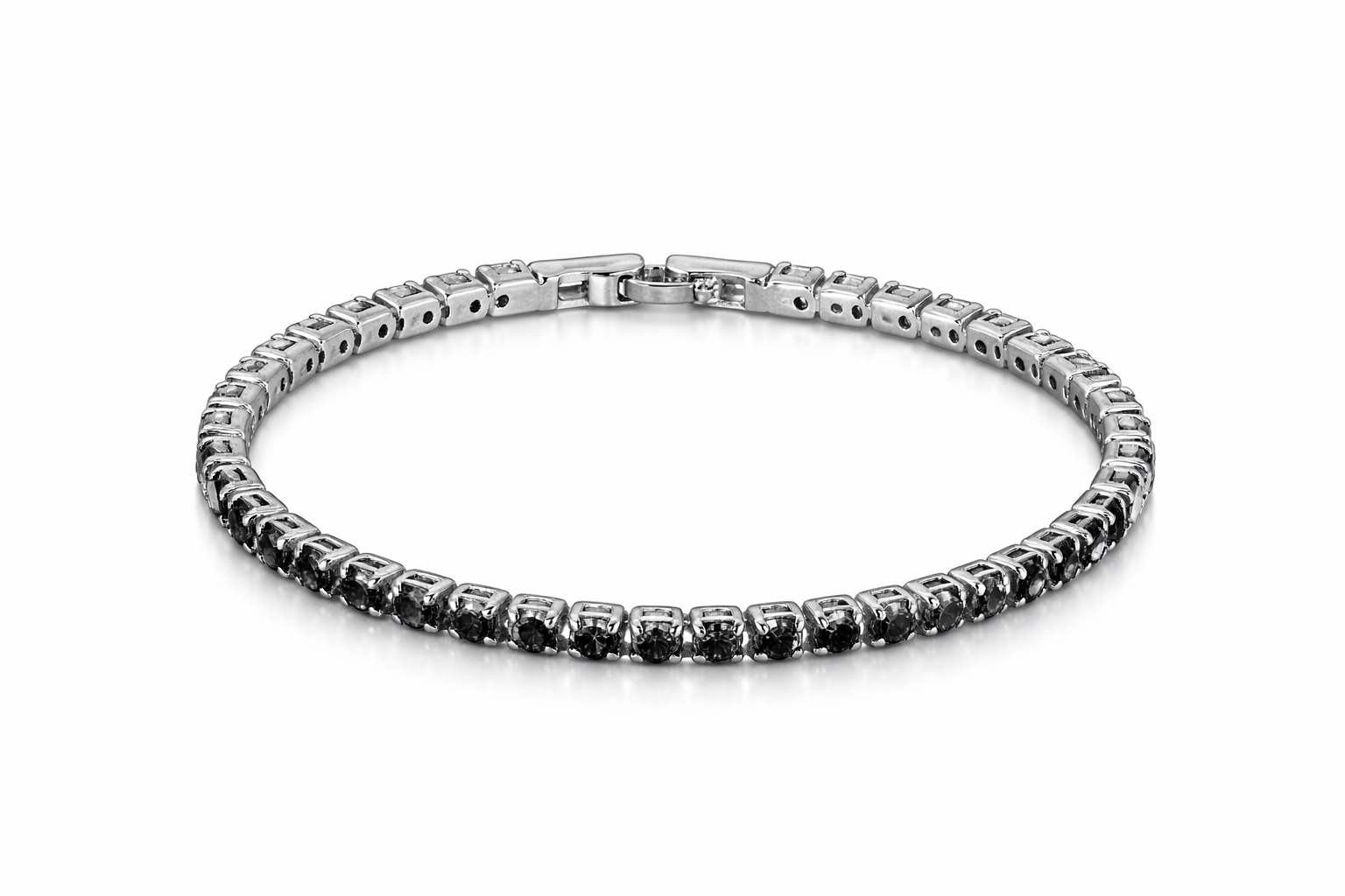 Silver bracelet with black stones on a white background