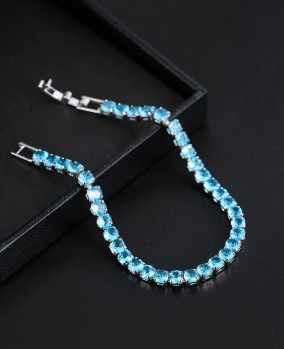 Blue beaded bracelet on a black surface